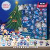 Doraemon advent calendar and figurines arranged around a Christmas tree.