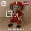 A crochet elephant plushie with a red football helmet and jersey!