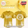 Cincinnati Reds gold jersey with 2025 Childhood Cancer Awareness logo and white ribbons.