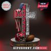 Atlanta Falcons cross-shaped statue with Bible verse and football elements.