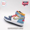 Side view of colorful sneaker with puzzle swoosh and red heart detail on heel.