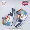 Symmetrical pair of colorful sneakers with puzzle swooshes on white background.