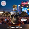 Skull bottle with bat wings and crown cap.
