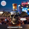 Skull bottle with bat wings and wooden cork cap.