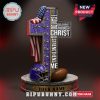 Baltimore Ravens cross-shaped statue with Bible verse and football elements.