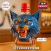 A bold cat head bottle featuring a red lid and a fierce blue design.