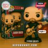 Aaron Bruch Funko Pop figure with gold bass guitar and black outfit next to product packaging.