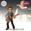 Crochet rock musician doll holding American flag guitar with concert backdrop.