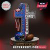 Buffalo Bills cross-shaped statue with Bible verse and football elements.
