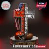 Cleveland Browns cross-shaped statue with Bible verse and football elements.