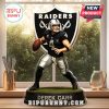 Derek Carr figurine displayed on a table near a window with outdoor view.