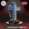 Detroit Lions cross statue with American flag, scripture text, helmet, and football.