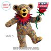 Multicolored crochet bear with red collar holding a rose.