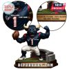 Close-up of Texans mascot figure jersey and engraved slogan on base.