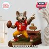 Chiefs mascot standee next to home decor with vase.