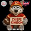 Crochet wolf mascot doll in red Chiefs outfit holding Chiefs Kingdom sign and football.