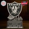 Las Vegas Raiders standee figure on dark wooden table with strong contrast.