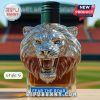 Lion head liquor bottle with green screw cap.