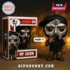 MF DOOM figure style 2 in box packaging with mask, cap, black shirt, camouflage pants, and microphone.