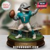 Miami Dolphins dolphin mascot statue on a table with blurred background.