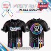 Dodgers black cancer awareness jersey with color splashes and ribbon emblem.