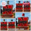 Collage of five Nebraska Huskers commemorative whiskey bottles with different cap styles.