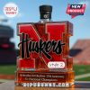 Nebraska Huskers commemorative whiskey bottle style 2 with a black cap.