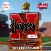 Nebraska Huskers commemorative whiskey bottle style 3 with a gold crown cap.