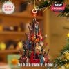 A festive guitar ornament shaped like a tree, with colorful guitars and a star on top.