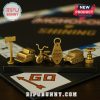Golden Monopoly tokens shaped like axe, typewriter, tricycle, Room 237 key, snowcat, and boiler valve.