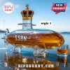 Submarine-shaped liquor bottle with a crown and a glass of whiskey.