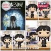 Funko Pop figures of Wednesday Addams in different poses and outfits.