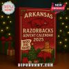 Razorbacks Advent calendar standing in front of a lit Christmas tree with holiday decorations.