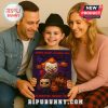 Smiling family holding horror-themed Advent calendar with child in center.
