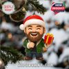 Close up of a single mini ornament from the Southern Spirit Advent Calendar featuring a bearded man in a Santa hat holding a gift hanging on a Christmas tree!