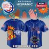 This image presents the front and back of a blue Chicago Cubs baseball jersey! The front has the team name Cubs and a circular design! The back features a large decorative pattern with the words Celebrate Hispanic Heritage Month! The team's circular logo is on the sleeve!