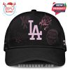 Black MGK cap with LA Dodgers logo in pink and layered punk visuals.