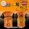 Combine your love for the New York Yankees and Hollow Knight Silksong with this unique jersey! Shop the new product today! This image features a black baseball jersey with front and back views! The front has the New York Yankees team name and a drawing of the character Hornet with her needle and thread! The back has a group of characters from the game! The logos for Hollow Knight Silksong and MLB are also on the jersey!