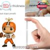 Hand holding thick acrylic Browns mini-ornament and peeling protective film!
