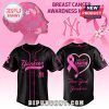 Los Angeles Dodgers Breast Cancer Awareness shirt and cap with pink ribbon design.