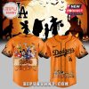 Los Angeles Dodgers Halloween baseball jersey with cartoon characters and festive designs.