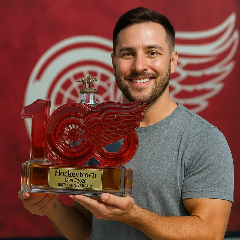 Close-up of Detroit Red Wings 100th Anniversary Whiskey Bottle Style 1, showcasing the winged wheel logo and premium whiskey inside.
