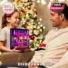 K-pop advent calendar on table with Christmas tree in background, showing glowing neon art.