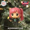 Pink-haired K-pop figurine with flashlight hanging on a Christmas tree.