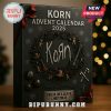 Korn Advent Calendar 2025 with Christmas tree lights in the background.