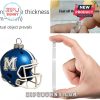 Hand holding thick clear acrylic panel next to blue Memphis football helmet ornament.