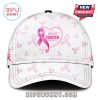 Breast cancer awareness cap with pink ribbons and a heart symbol.