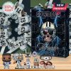 Dallas Cowboys advent calendar with figures, keychains, and themed accessories displayed in front.