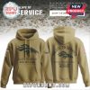 Denver Broncos Salute to Service hoodie in tan with dark logo and American flag patch.