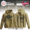 Dallas Cowboys Salute to Service hoodie in olive with star logo and patriotic sleeve patch.